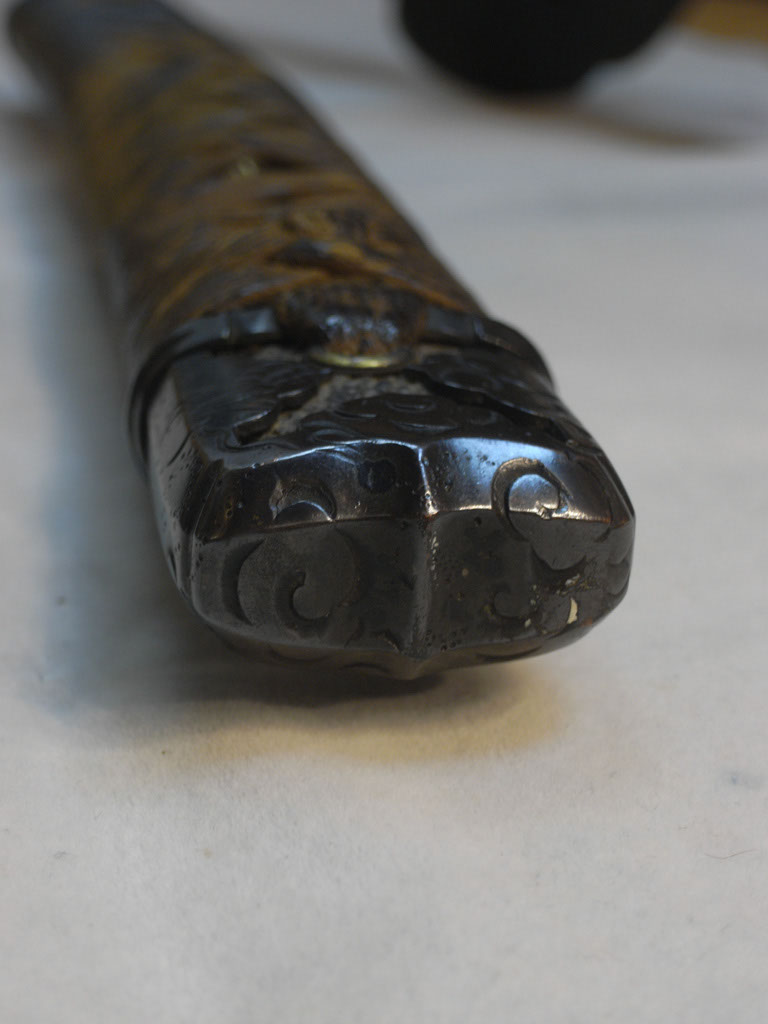 The tsuka of this sword features a kabuto-gane typical of tachi mountings rather than a kashira.