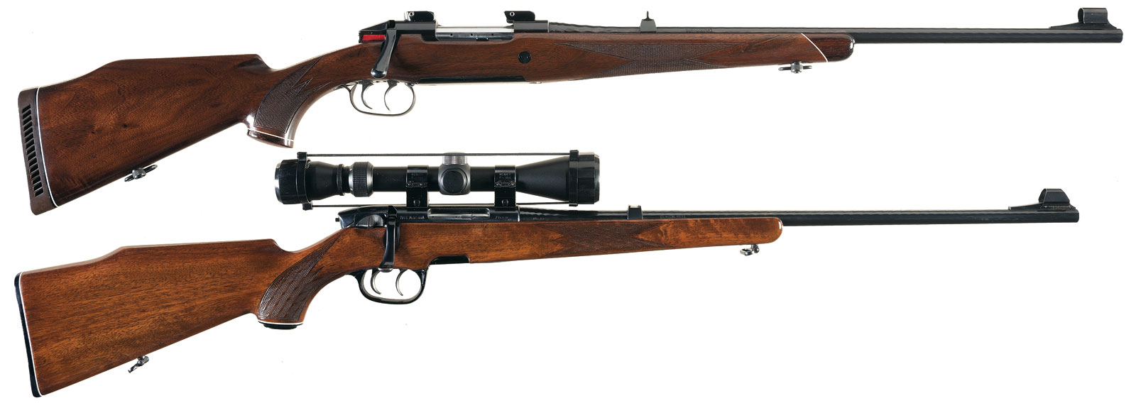 Top rifle is a The Mannlicher Schönauer M72, lower rifle is a Steyr-Mannlicher of the seventies with its plastic fittings. The The Mannlicher Schönauer M72 as you can see is a graceful blending of blued steel and walnut: the Steyr Mannlicher is a blend of blued steel, walnut and plastic that becomes one of the ugliest sporting rifles in existence.