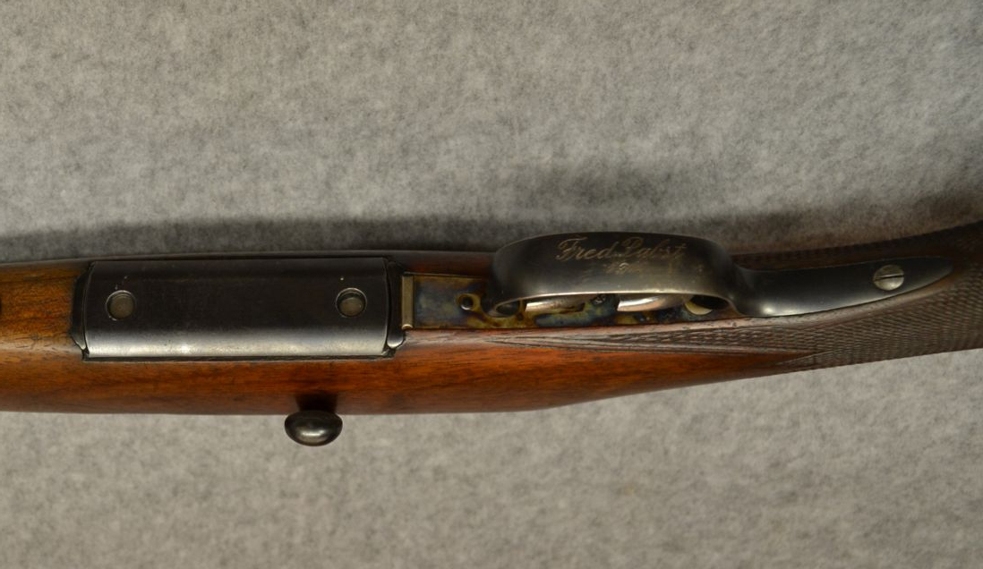 The name Fred Pabst under the trigger guard is potentially curious. This could not be Fred Pabst senior who founded the Pabst Brewing Company of Milwaukee as he passed away in 1904, the year prior to this rifle's release. But it could belong to his son Fred Pabst Junior. (Picture courtesy Cabela's).