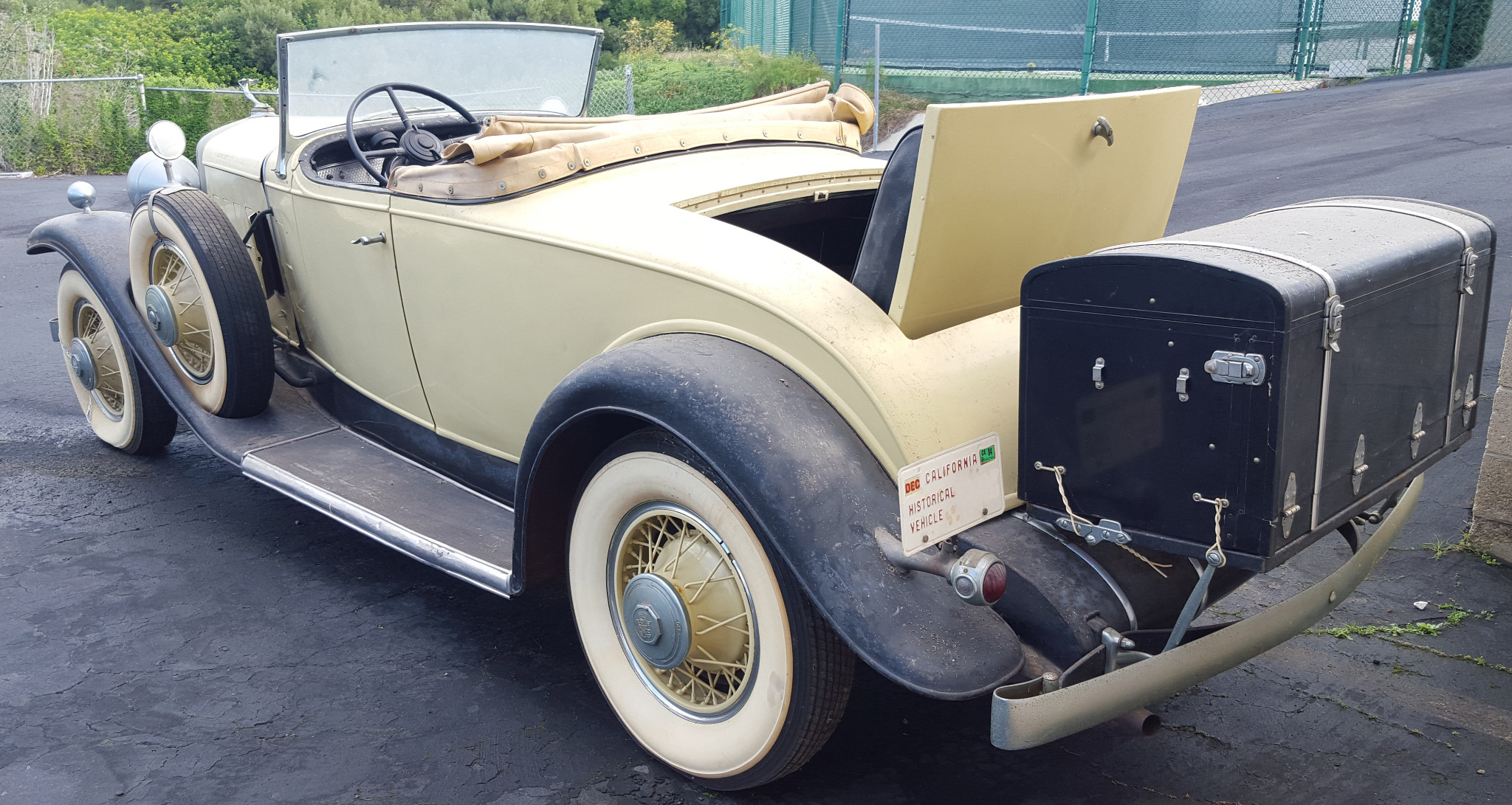 This Cadillac features a rumble seat, storage compartment for golf clubs and a trunk. (Picture courtesy bringatrailer.com).