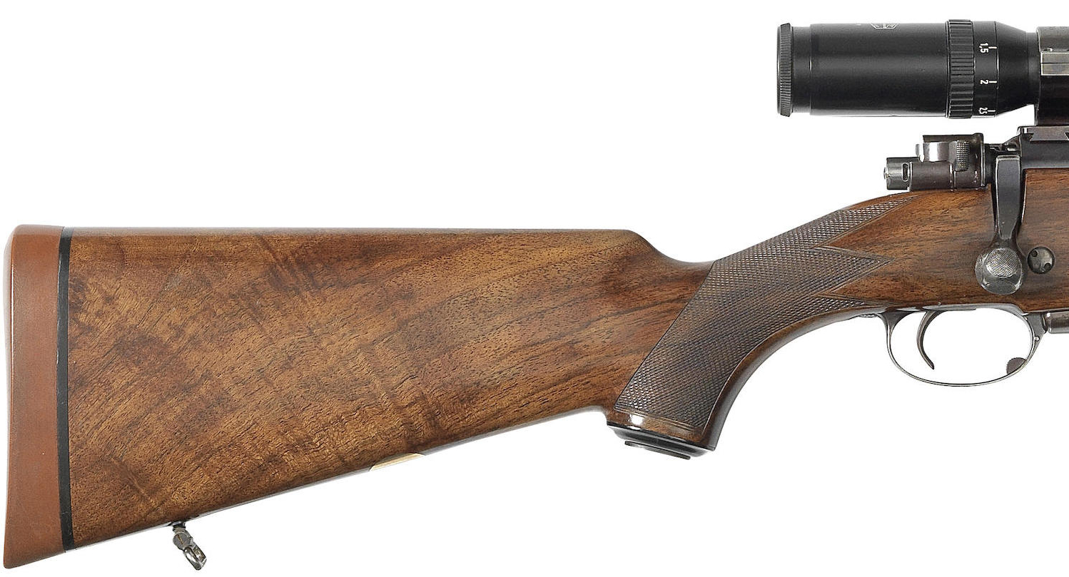 Stock wood on this rifle is not fancy but is straight grained, practical, and interesting.