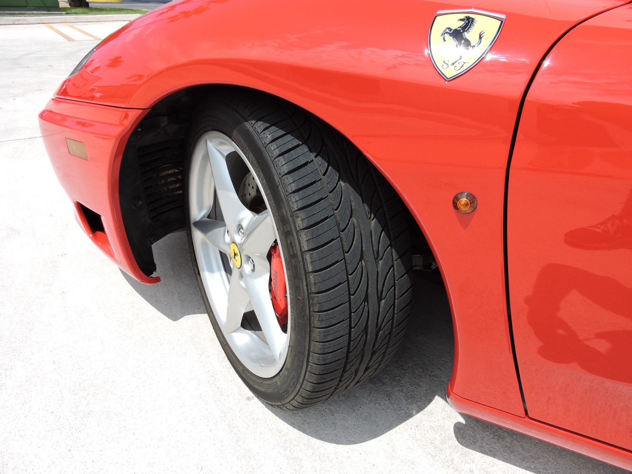 The car has the optional red brake calipers. Tires are 40%.