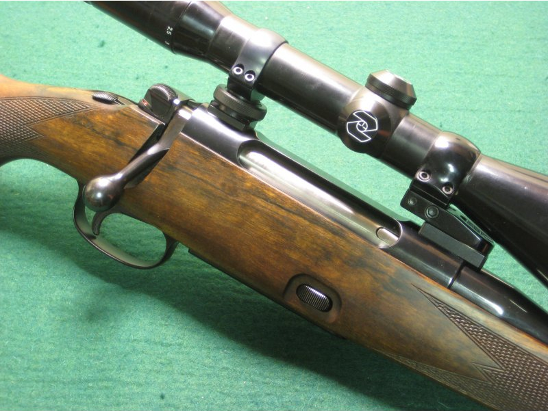 The Mauser 77 was an effort at ensuring a rifle with a detachable magazine that could accommodate more capacity for culling work. The safety catch is mounted on the bolt shroud. The small button on the right side of the tang is to set the set trigger mechanism. (Picture courtesy huntershouse.dk).