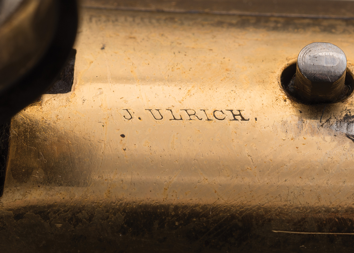 This presentation rifle is signed by master engraver John Ulrich.