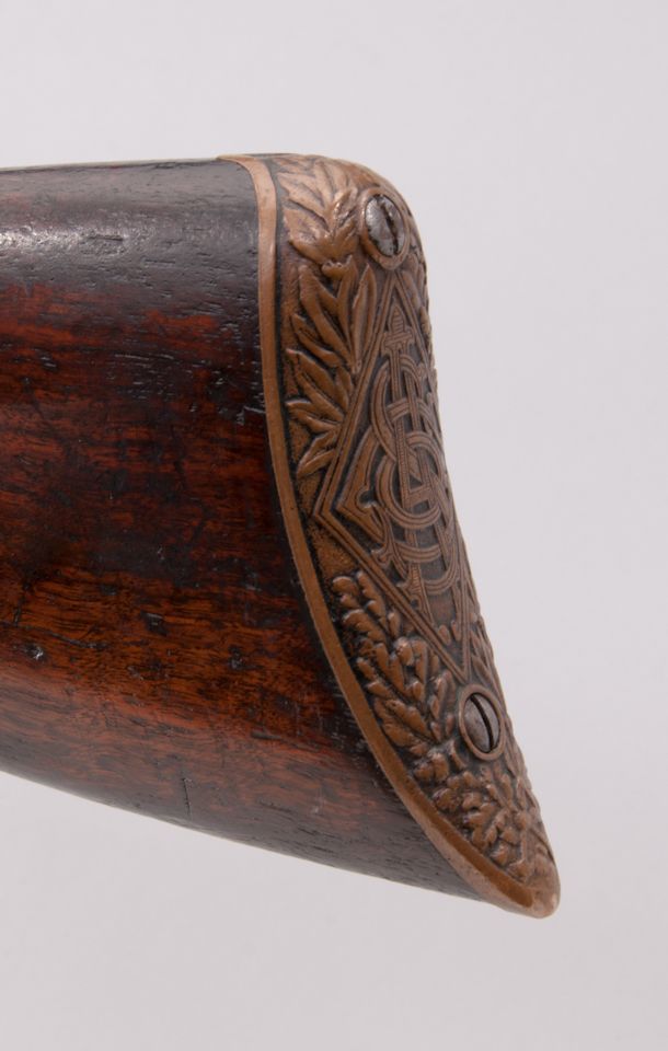 Morris Smith made sure his rifle looked good and he did this not only by styling his rifle so it looked modern but also by fitting an elaborate butt plate and an equally elaborate slide handle. (Picture courtesy icollector.com).