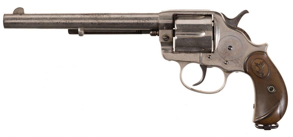 This nickel finish Colt Model 1878 has the original gutta percha "hard...